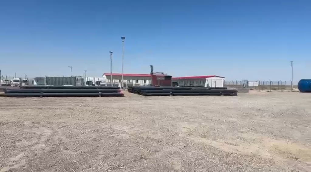 Condor Energies yard — pipe stacks, modular site buildings and staging